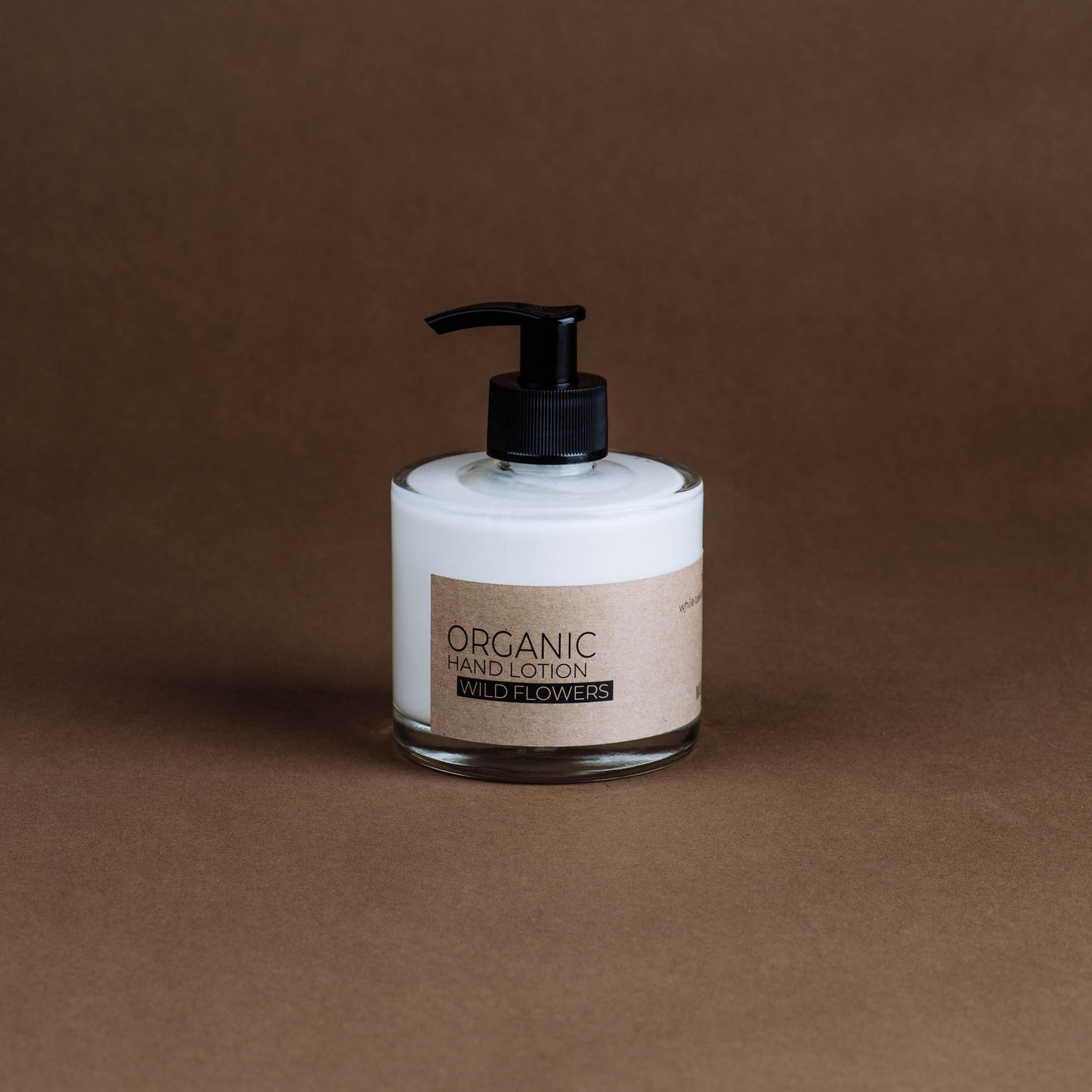 Wild flowers organic hand lotion in glass bottle