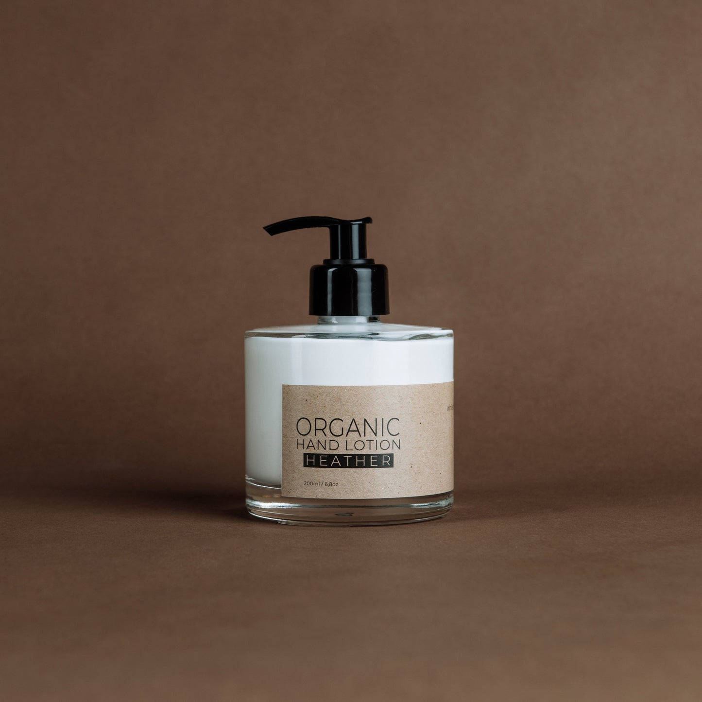 Heather organic hand lotion in glass bottle