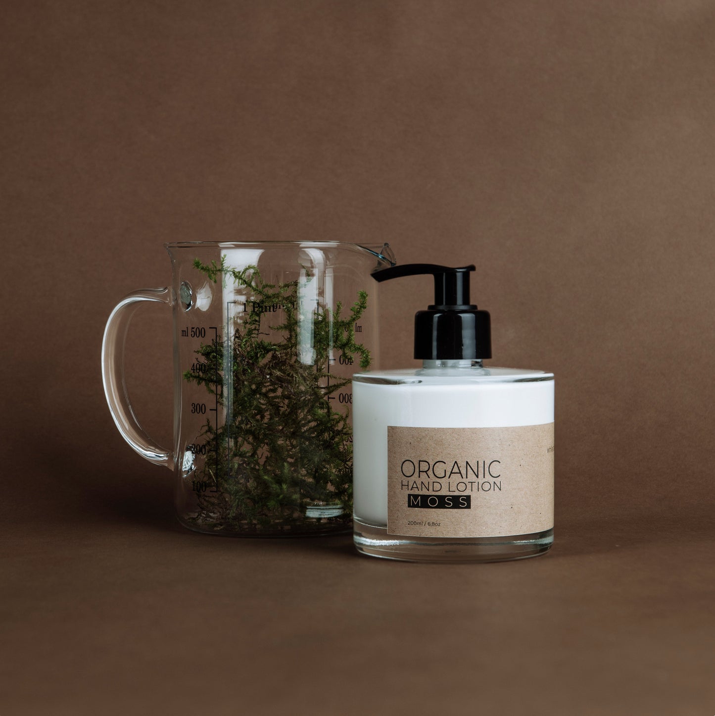 Moss organic hand lotion in glass bottle