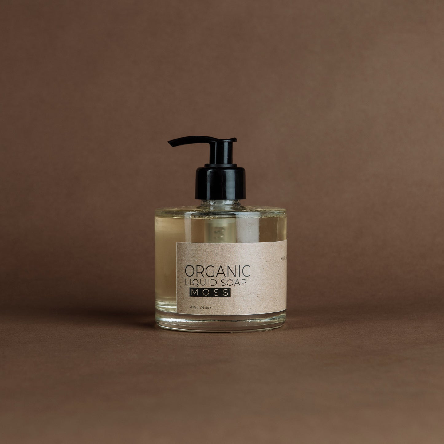 Moss organic liquid soap in glass bottle