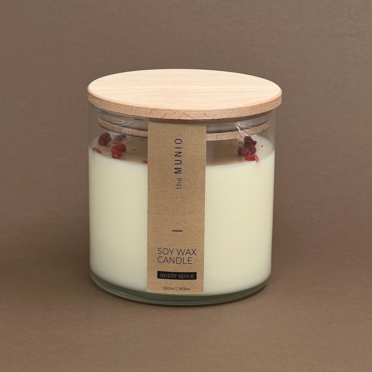 Apple spice candle in a glass votive with 2 wicks
