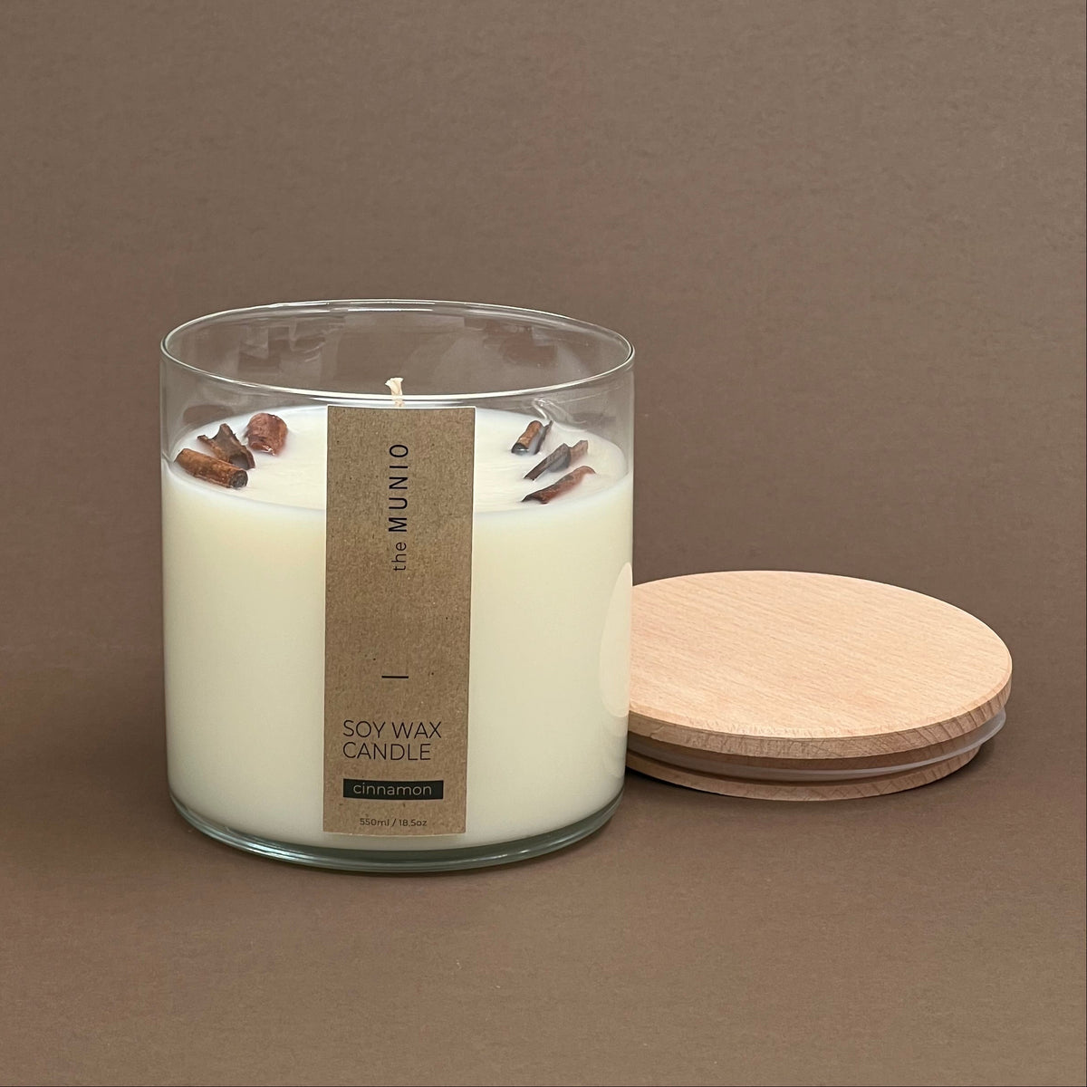 Cinnamon candle in a glass votive with 2 wicks