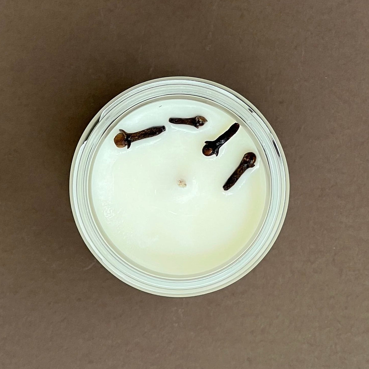 Cloves & orange candle in glass jar