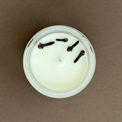 Cloves & orange candle in glass jar