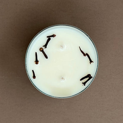 Cloves & orange candle in a glass votive with 2 wicks