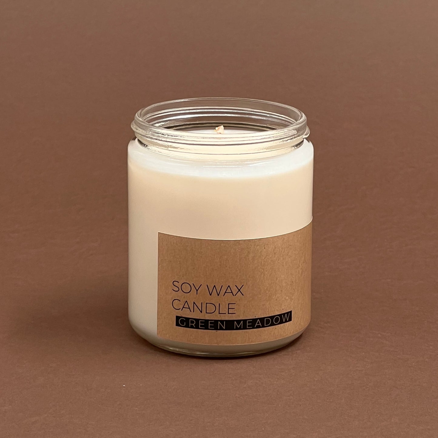 Green meadow candle in glass votive