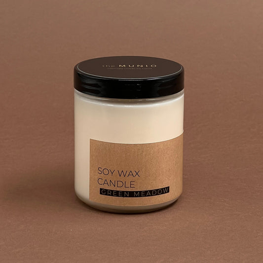 Green meadow candle in glass votive