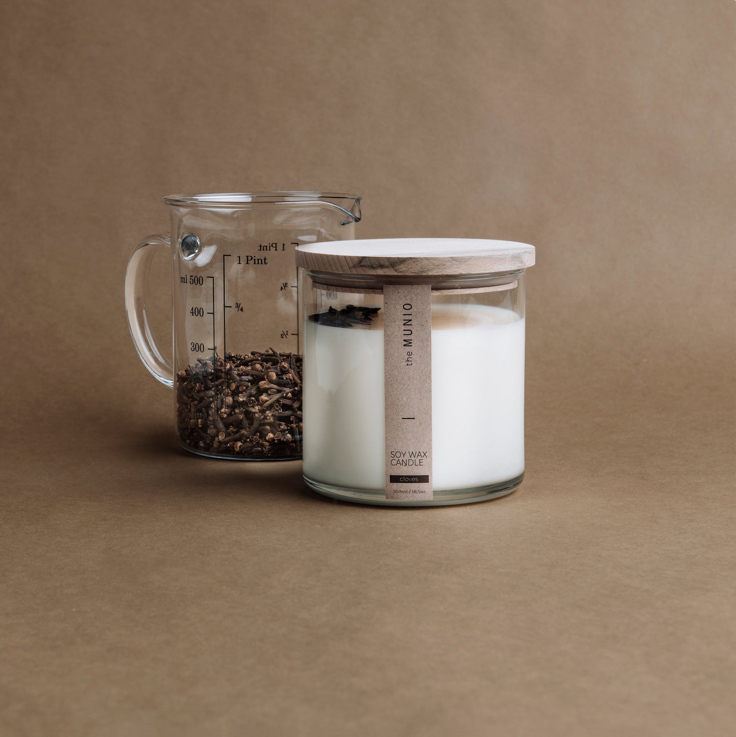 Cloves & orange candle in a glass votive