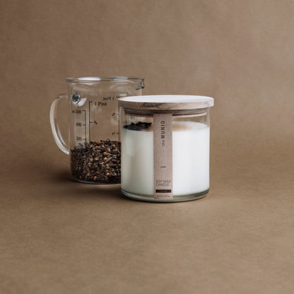 Cloves & orange candle in a glass votive