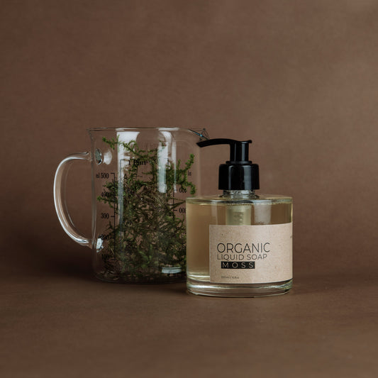 Moss organic liquid soap in glass bottle