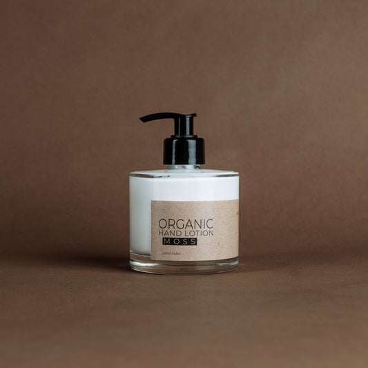 Moss organic hand lotion in glass bottle